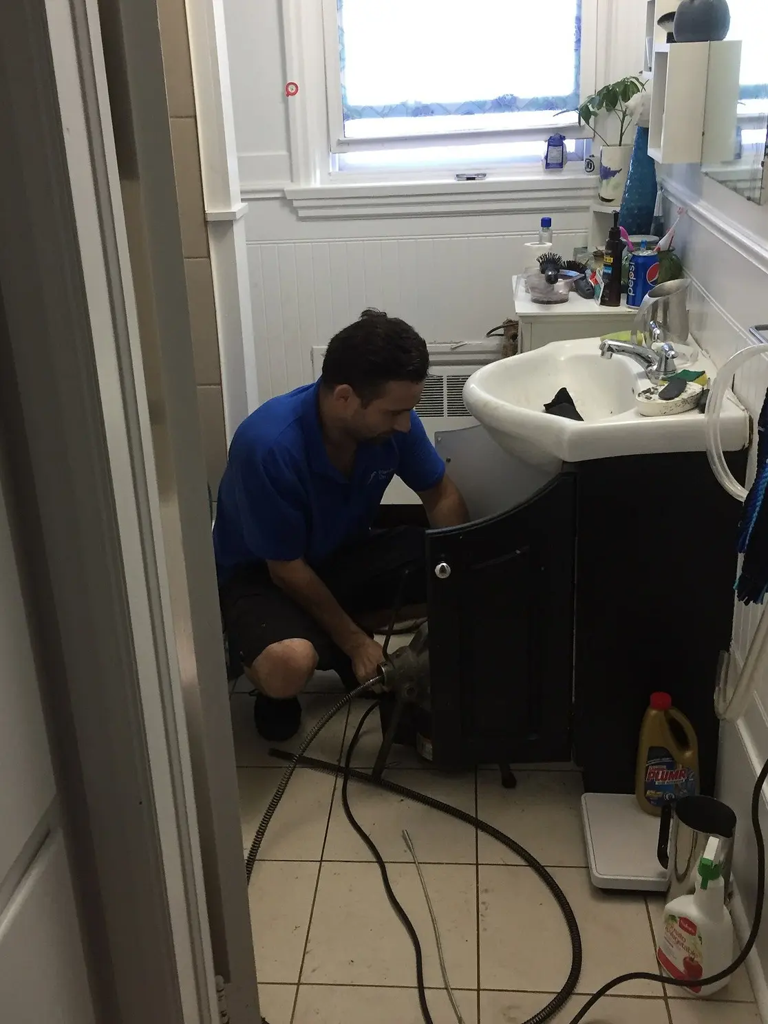 Licensed plumber working on a residential repair